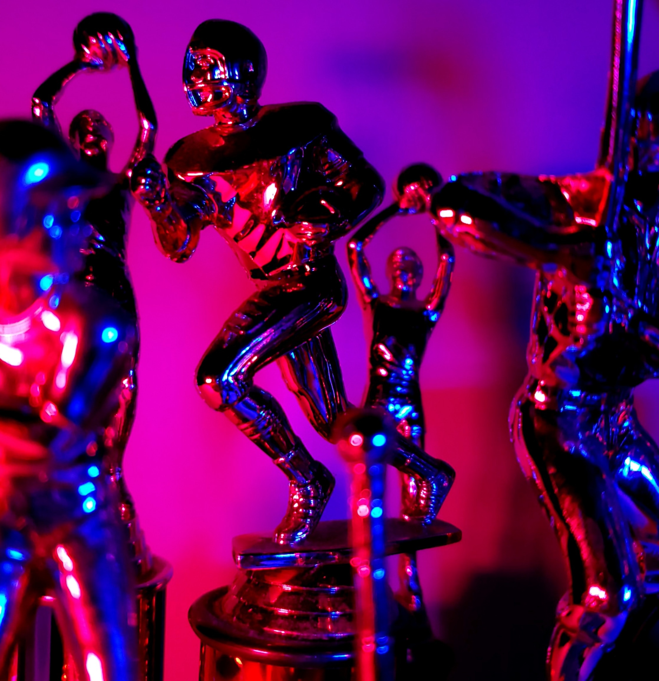 Sporting trophies in blue-and-pink light