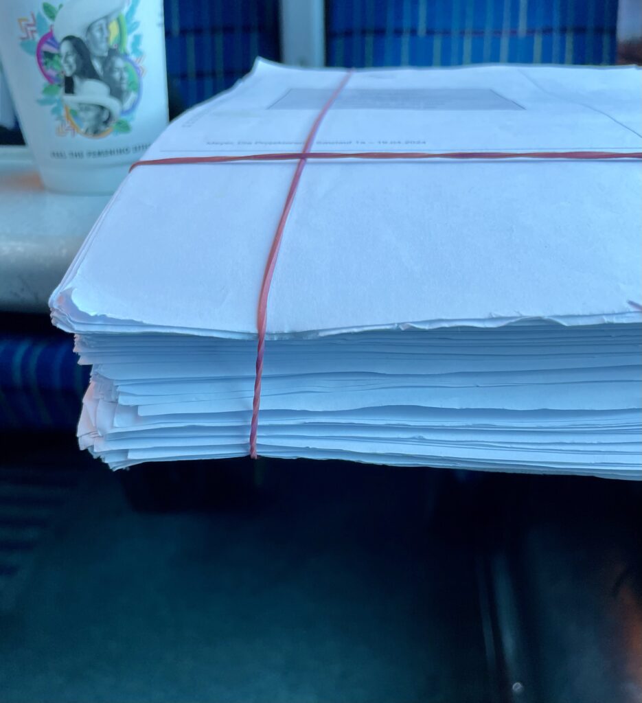 A very fat manuscript on a train table